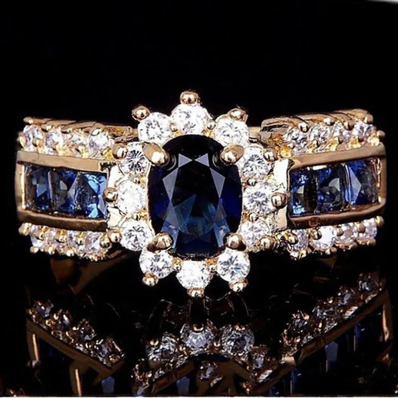 Personalised zinc alloy unisex ring in sunflower blue diamond and square zircon designs on a size chart.