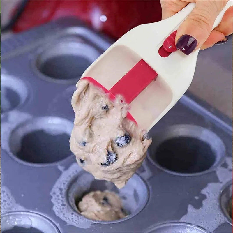 Photo-colour cake batter scoop with push lever on handle, 19.5 cm long, on white background