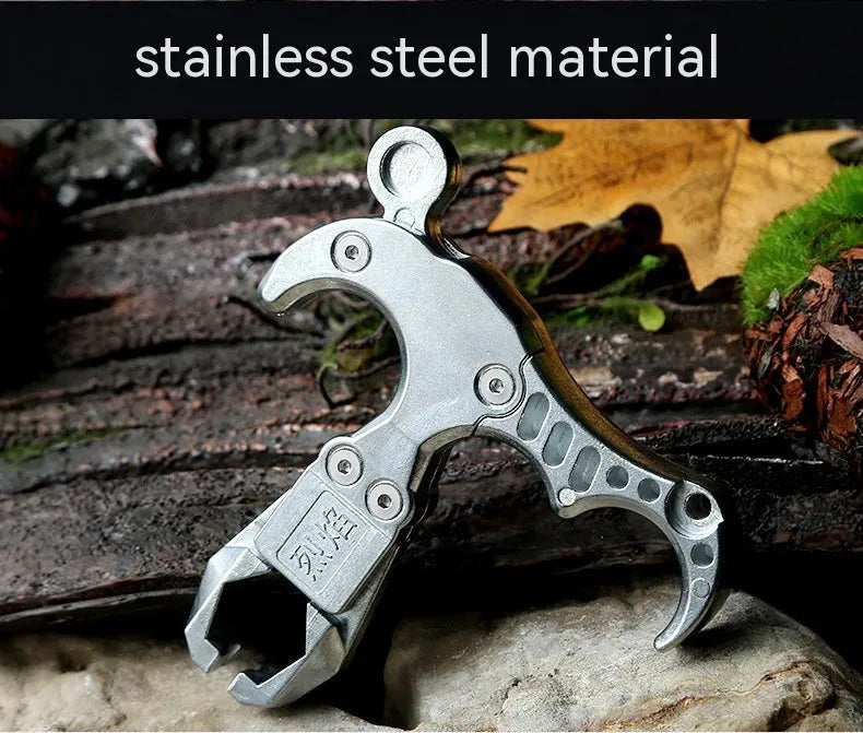 Close-up of a zinc alloy two-axis harpoon clip release aid with stainless steel mechanism.