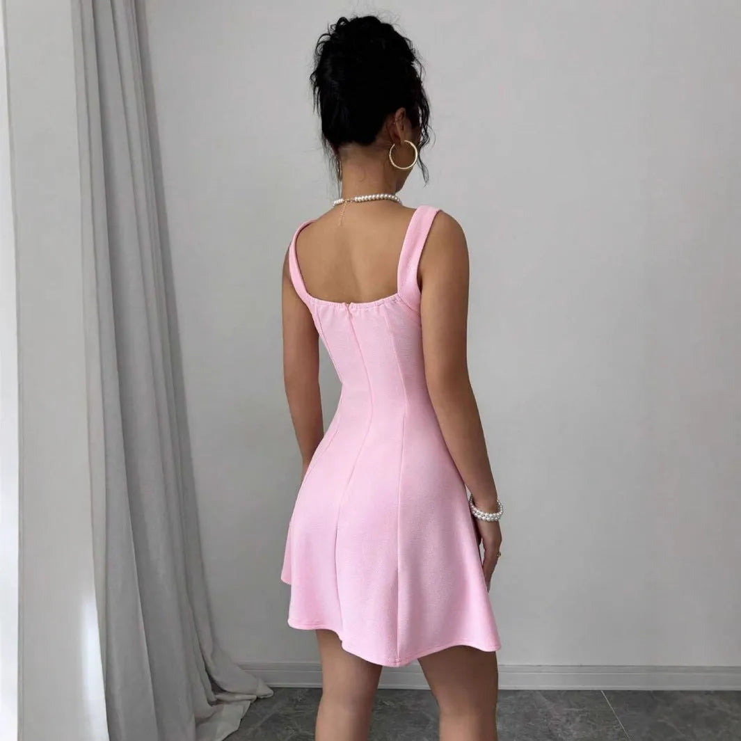 Pink high-waist suspender dress with A-line skirt and sleeveless design, made from polyester.