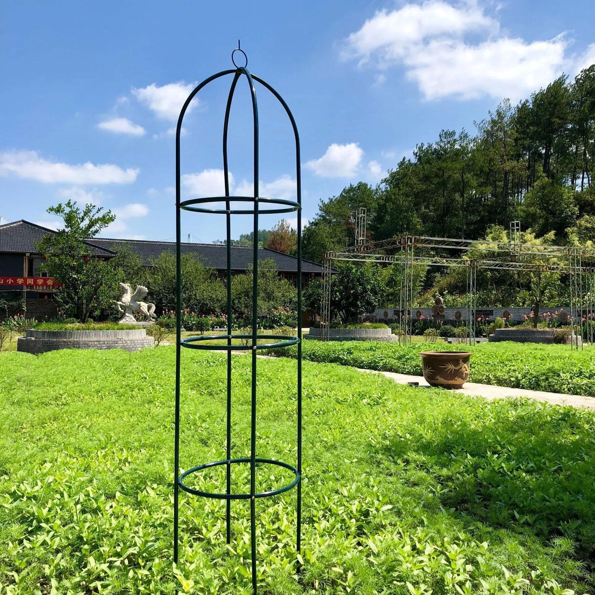 Dark green wrought iron plant climbing frame with lattice panels measuring 188 cm tall