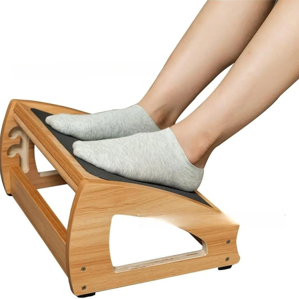 Wooden adjustable bamboo office desk footstool in natural wood colour.