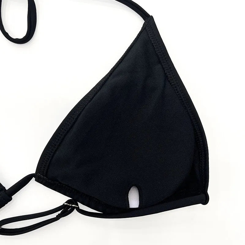 Black long sleeve mesh bikini four-piece swimsuit set for women on a mannequin.