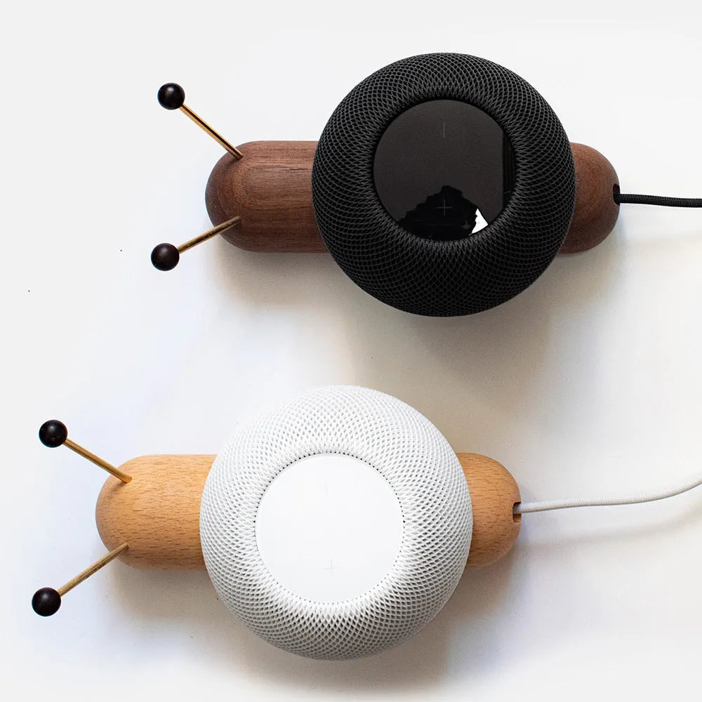 Khaki brown desktop non-slip bracket holding a smart Bluetooth speaker.