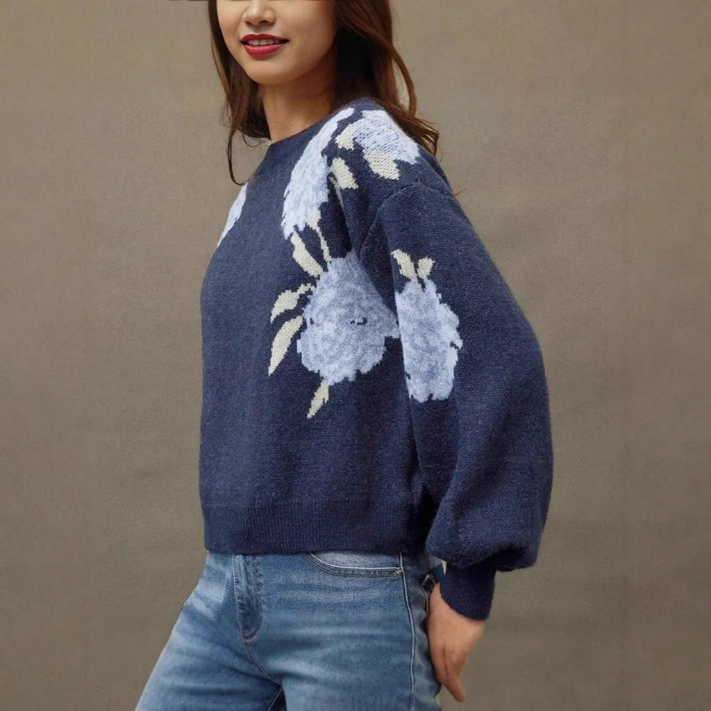 Sapphire blue women's loose pullover with a white floral jacquard pattern, off-neck design, and long sleeves.
