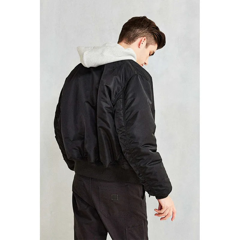 Men's army green loose fit nylon pilot jacket with cotton padding on a hanger.
