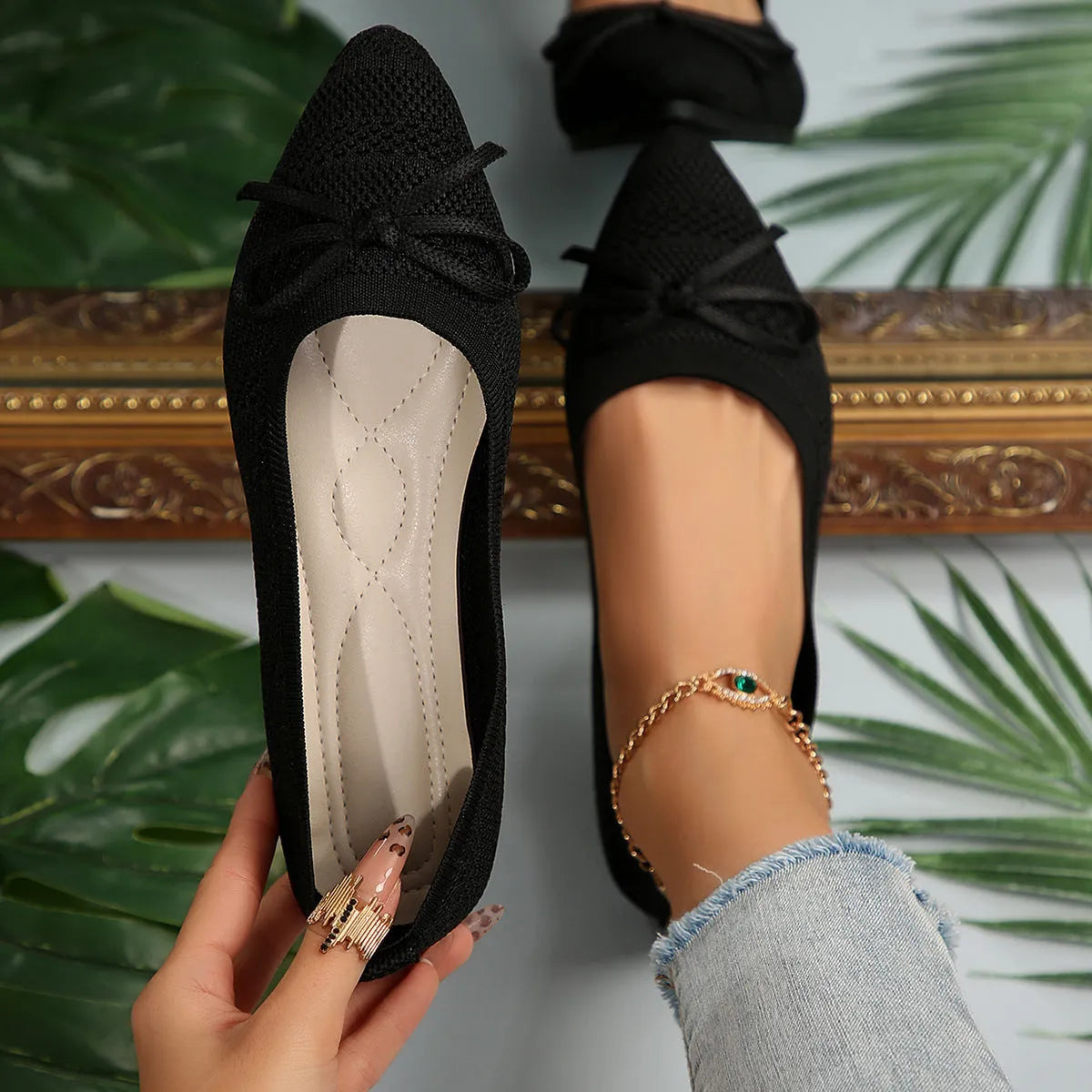 Women's knitted loafers with bow decoration in various colours showing flat rubber soles