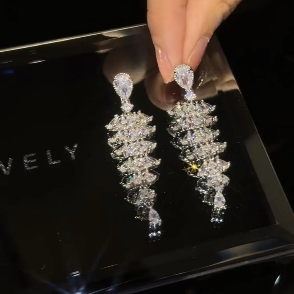 Silver pagoda Christmas tree drop earrings with sparkling zircon elements on copper construction