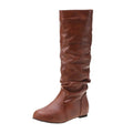 Women's flat round toe slip-on ankle boots in black PU leather with a high shaft and rubber sole.