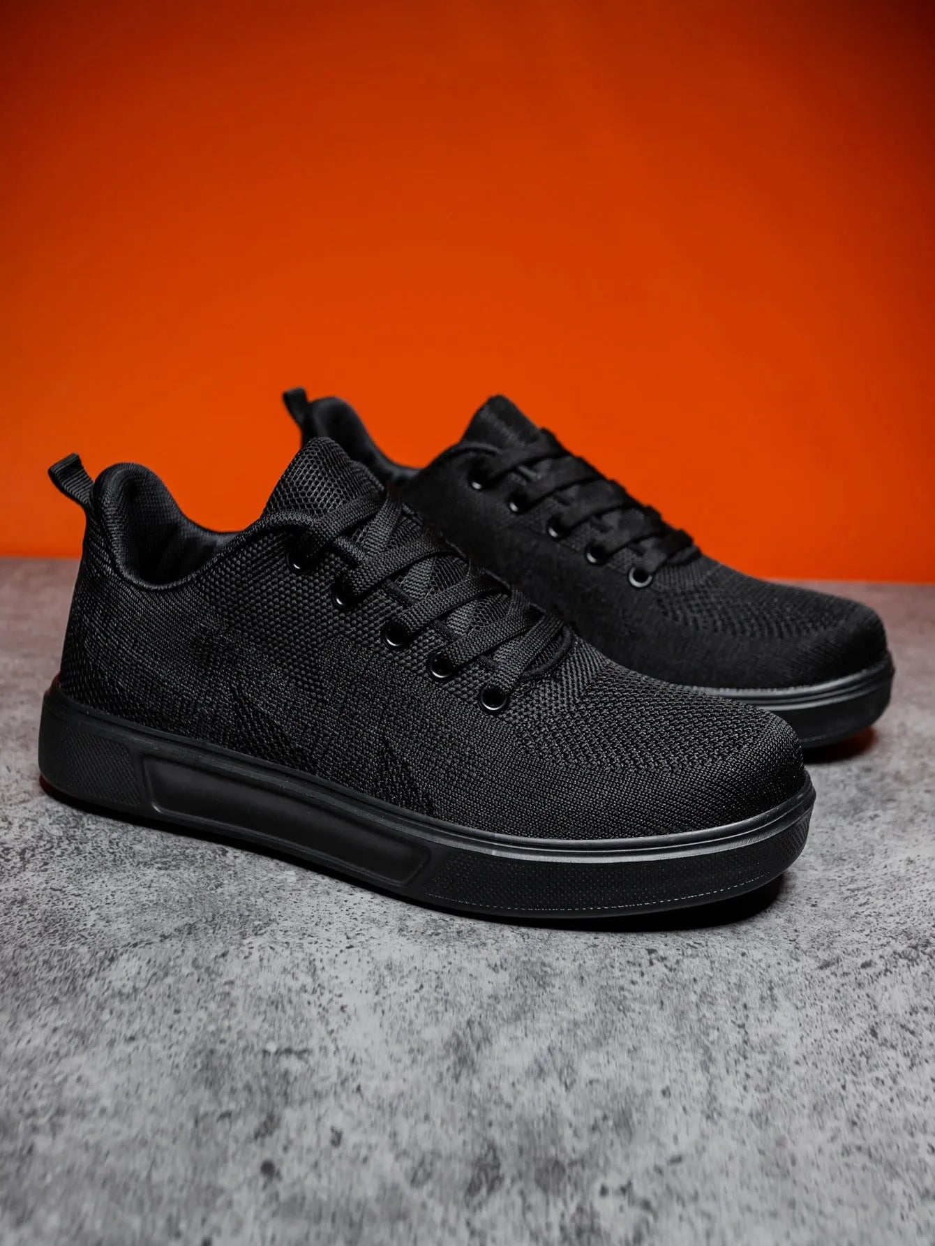 Light white thick sole casual sports shoes with mesh upper and lace-up front.