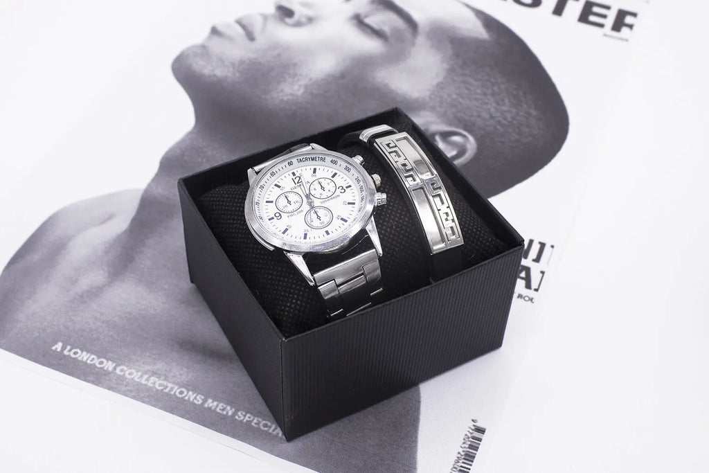 Men's quartz wrist watch set with round alloy dial, black face, and stainless steel buckle on a plain background