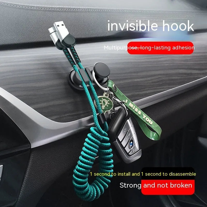 Car data cable storage hook in dark green with adhesive mount for vehicle interiors