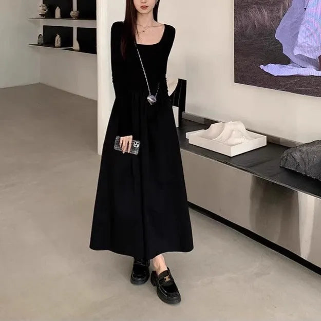 Women's black square collar knitted A-line dress with long sleeves and an elastic waist.