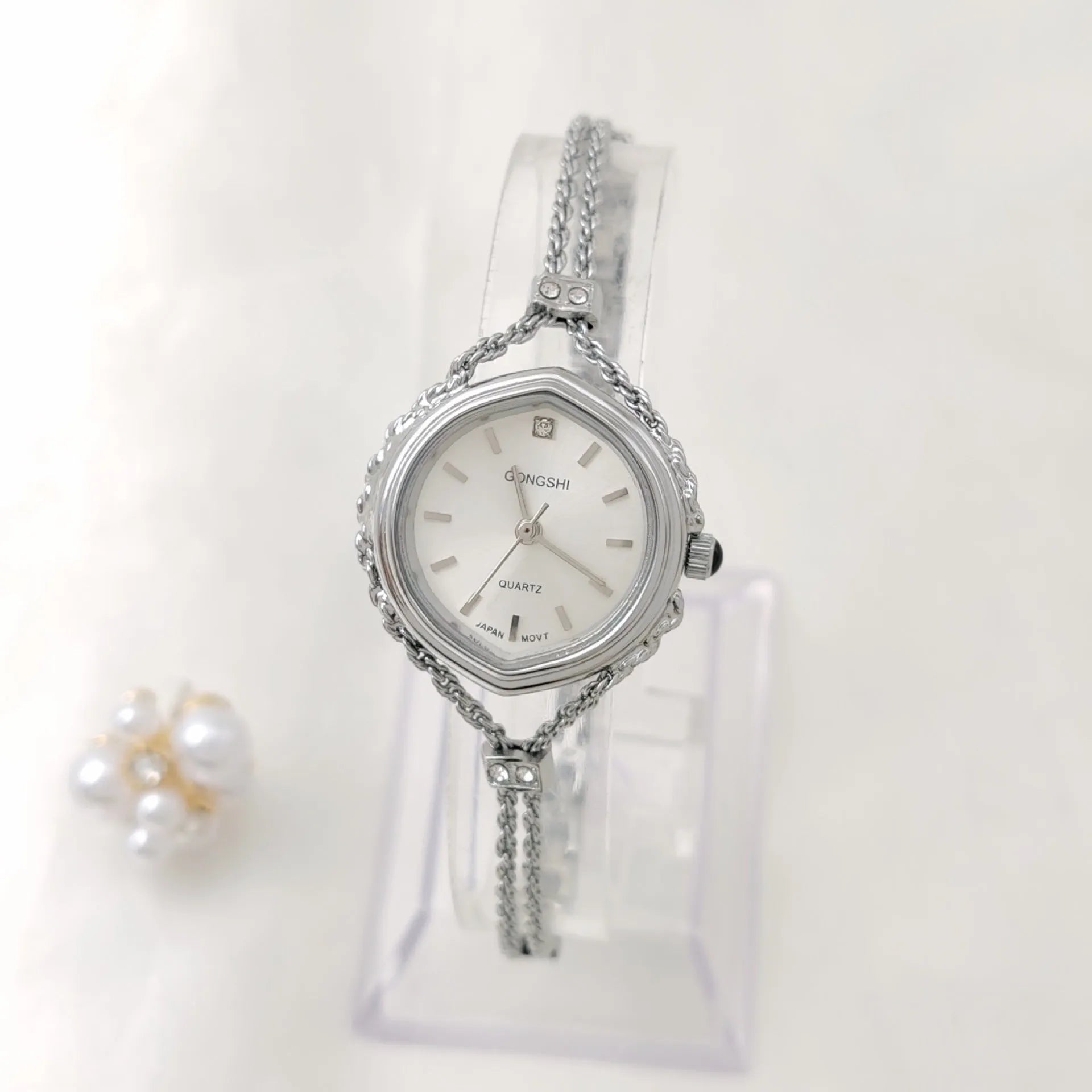 Gold or silver Mori-style women's quartz watch with a 25mm dial and metal chain strap.