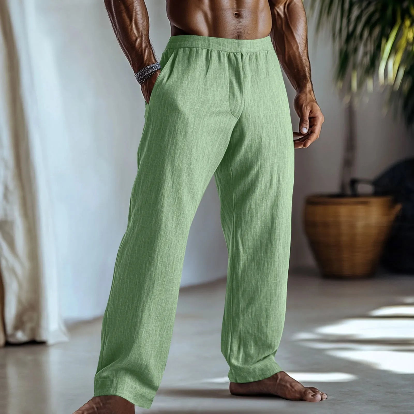 Man wearing straight-leg cotton linen casual trousers in a solid colour with pockets.