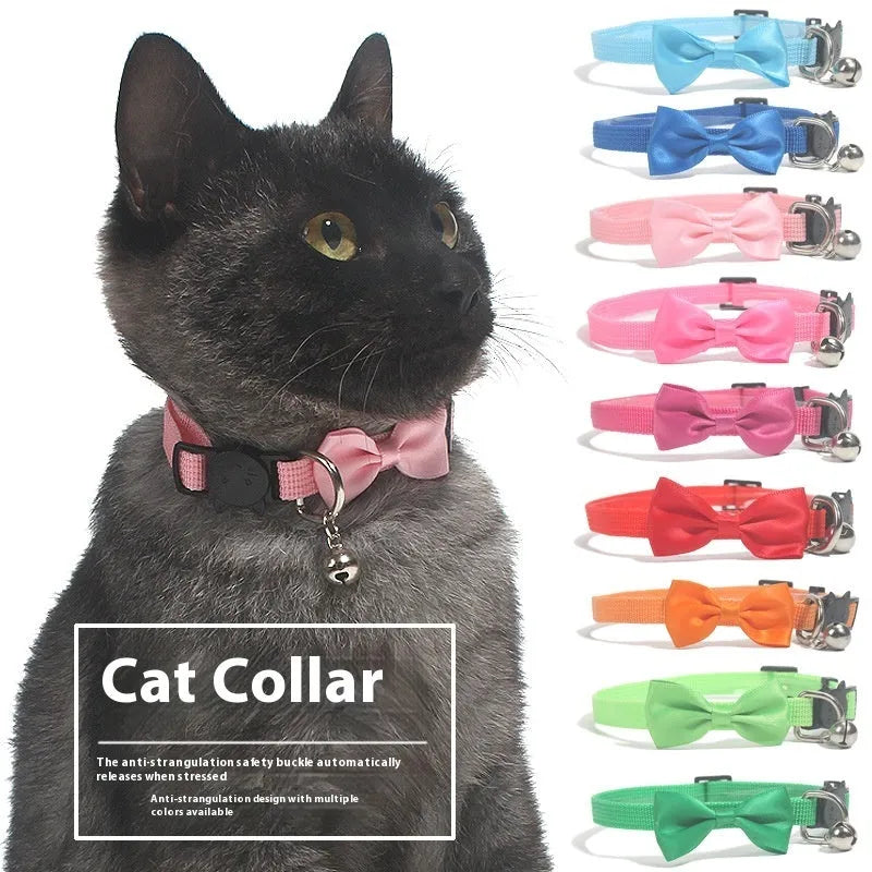 Adjustable nylon cat collar with decorative bow and bell in striped cartoon pattern, multiple colour options shown