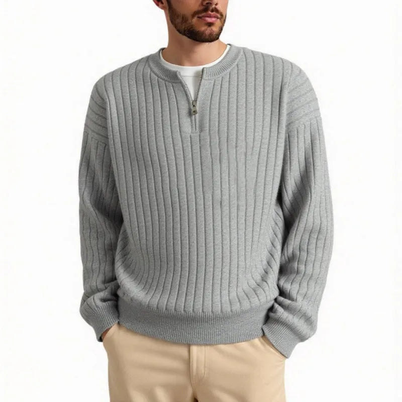 Men's loose grey half zipper textured knit sweater on a hanger.