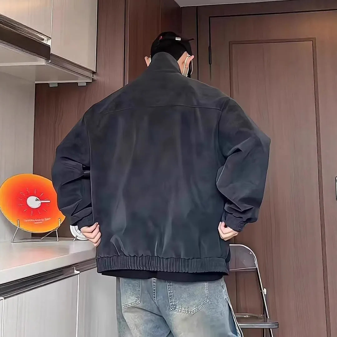 Grey tie-dye PU leather jacket with a stand collar and side pockets on a male model.