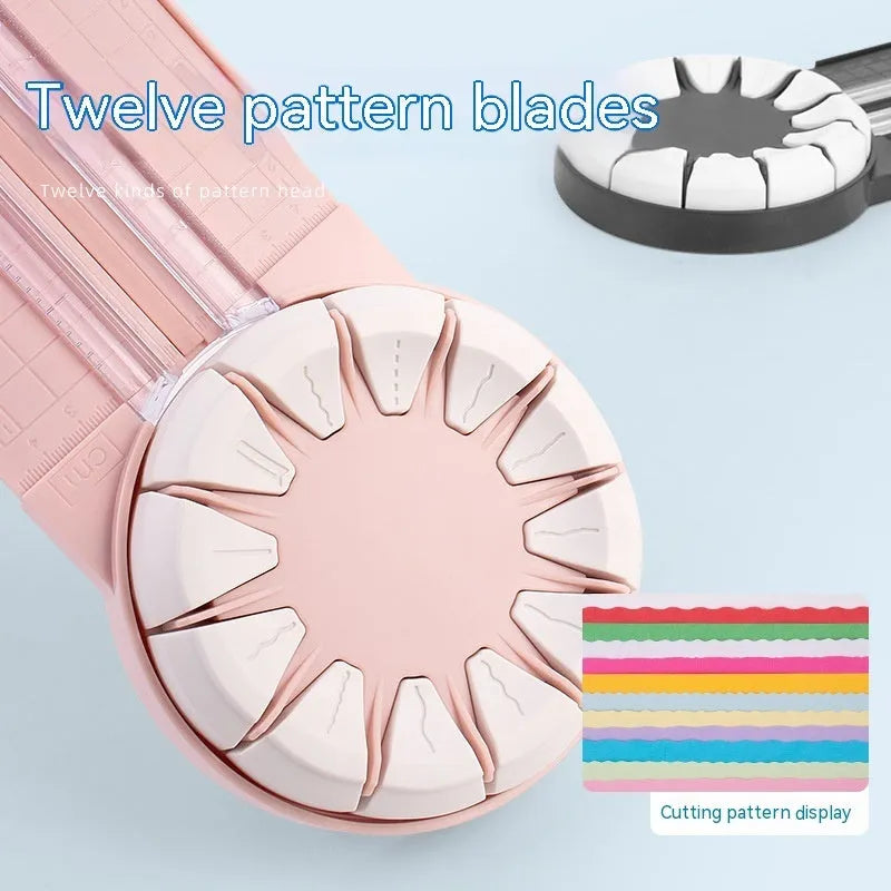 Pink and black 12-in-1 manual plastic paper cutting machine on a white background.