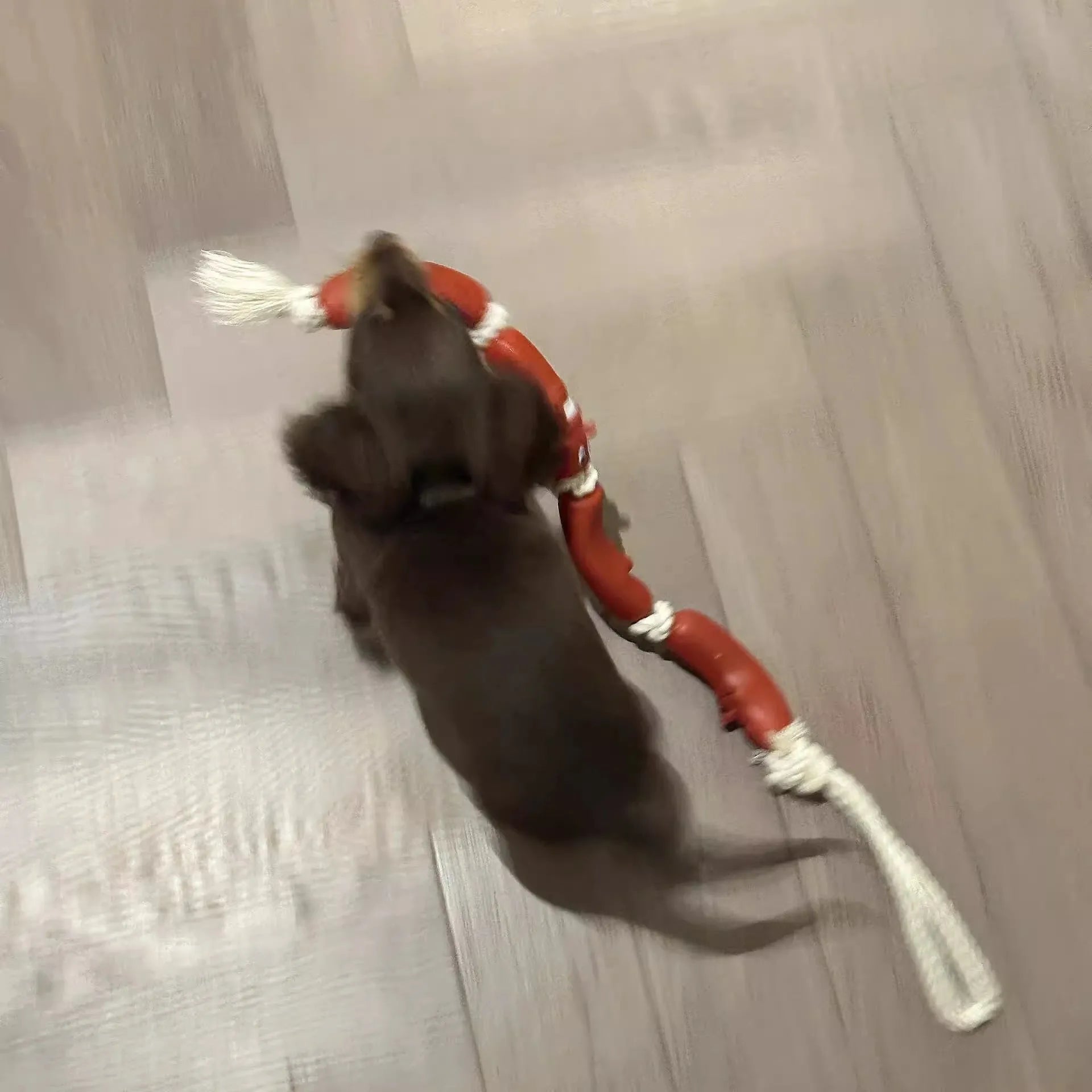 Brown sausage-style dog rope toy with hand grip tape, shown at full 108cm length