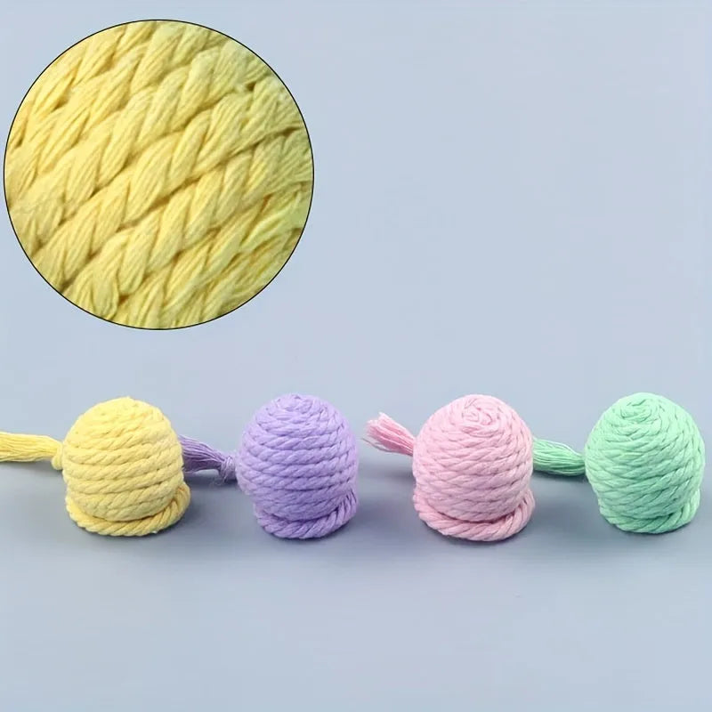 Colourful cat toy ball with attached rope, internal bell makes sound when rolled