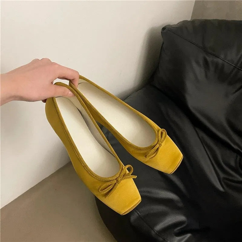 Women's satin shoes with hidden heels, square head and bow detail, available in six solid colours, sizes 35-40.