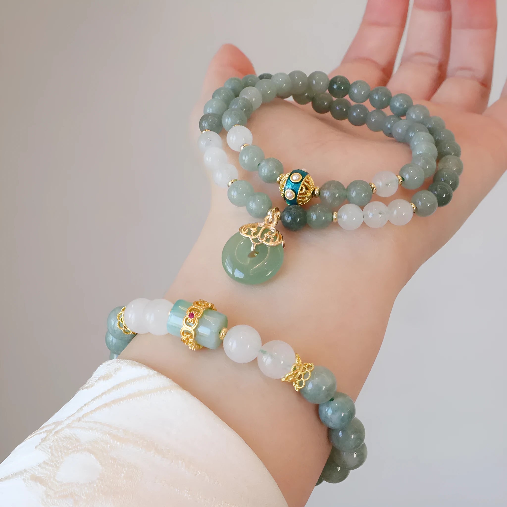 Women's Myanmar jade bracelet with Peace Buckle charm and crystal elements in geometric New Chinese style design