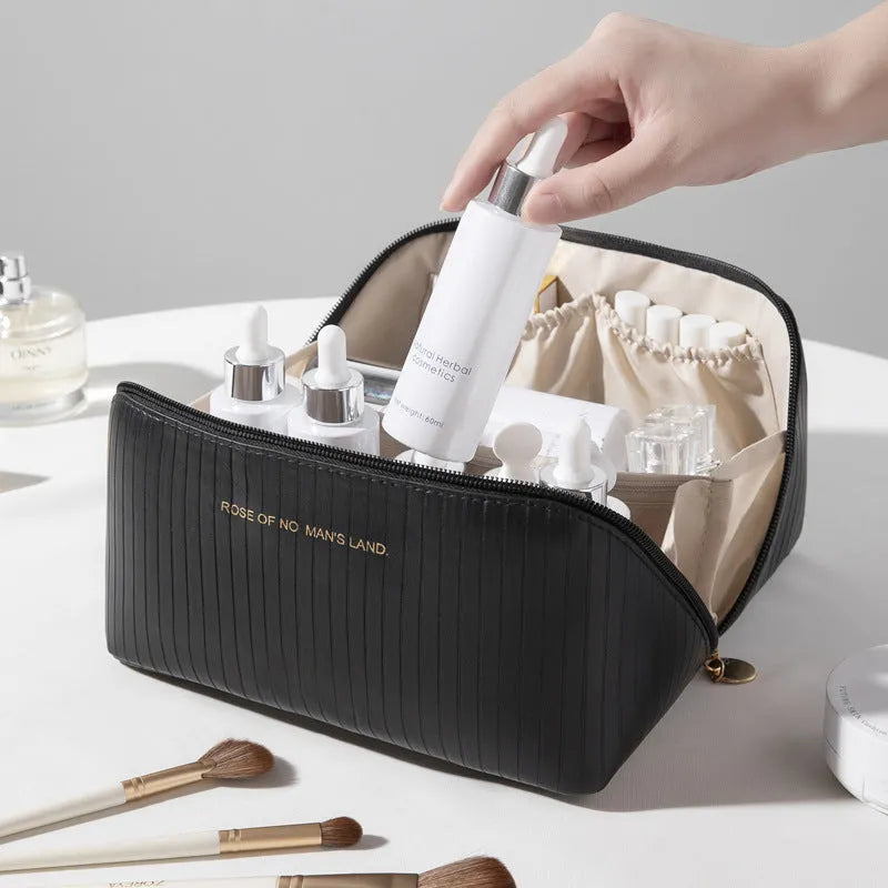 Vertical pattern cubic PU makeup bag in beige, 22.5cm length, for travel cosmetics storage.