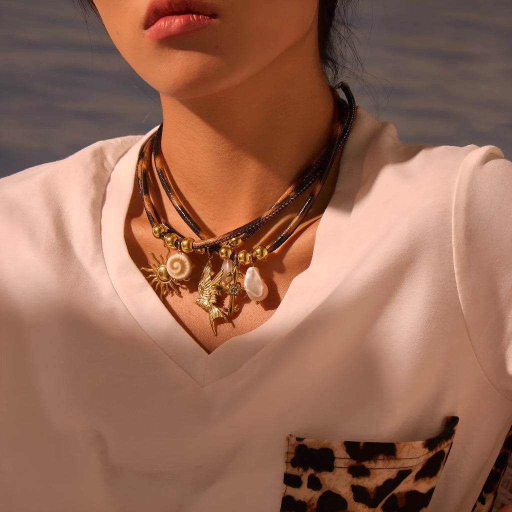 Women's stainless steel leopard pendant necklace with geometric design and gold-plated finish on adjustable chain