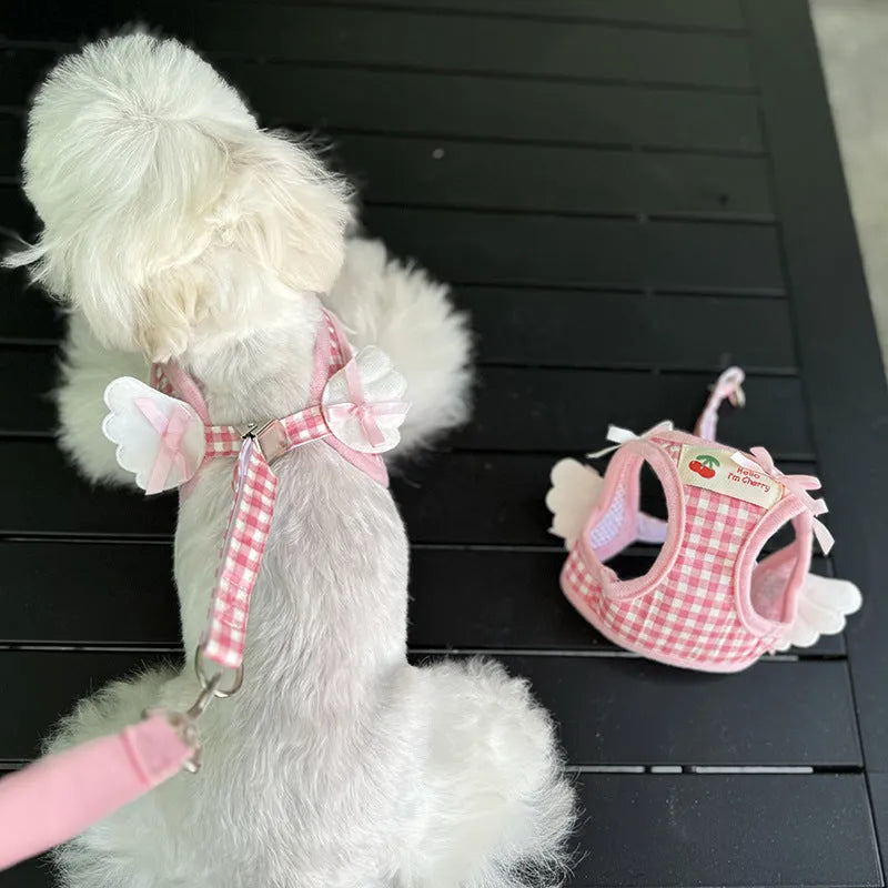 Small dog wearing pink cotton chest and back harness with integrated lead rope