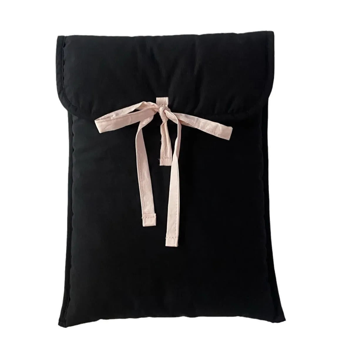 Black and white quilted women's laptop bag with striped pattern and a ballet-style bow.
