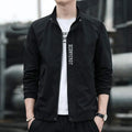 Men's black stand collar casual sports coat made from polyester fabric on a hanger.