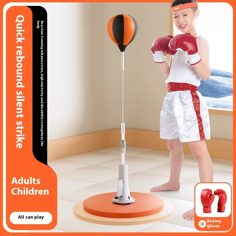 Vertical inflatable speed ball punching target with PU ball, boxing gloves and bandages on a wood floor for home training