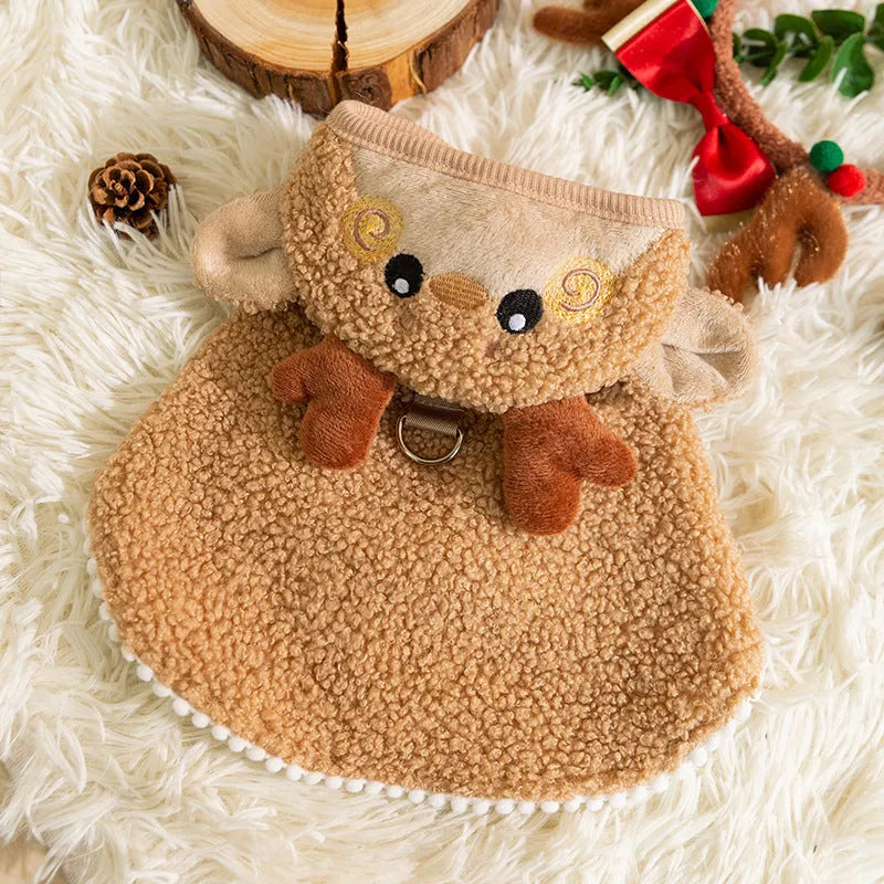 Green granular velvet Christmas pet cape with tree-shaped hat and star on a small dog