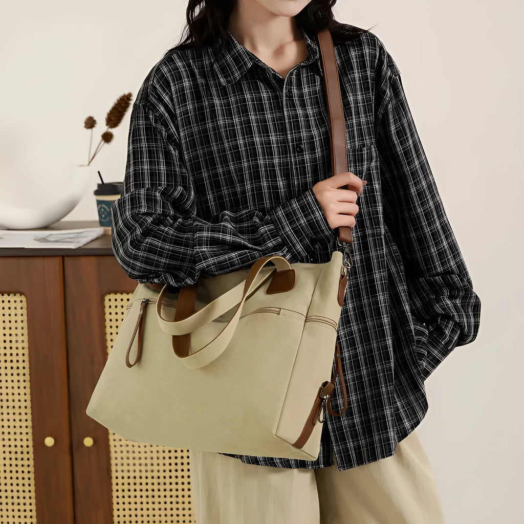 Grey retro-style canvas women's handbag with large capacity and internal pockets.