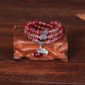 Watermelon crystal bracelet with Chinese knot design showing geometric natural stone beads