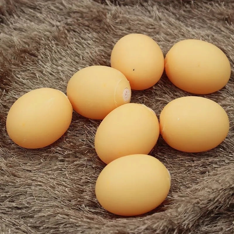 Natural rubber egg-shaped dog chew toy with a squeaker inside for dental play.