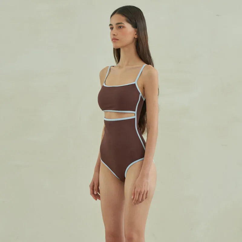 Brown nylon triangle one-piece swimsuit for women on a hanger