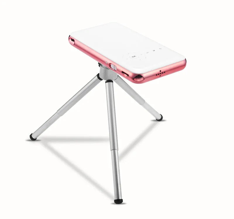 White and rose gold miniature portable smart DLP Android projector showing compact size.