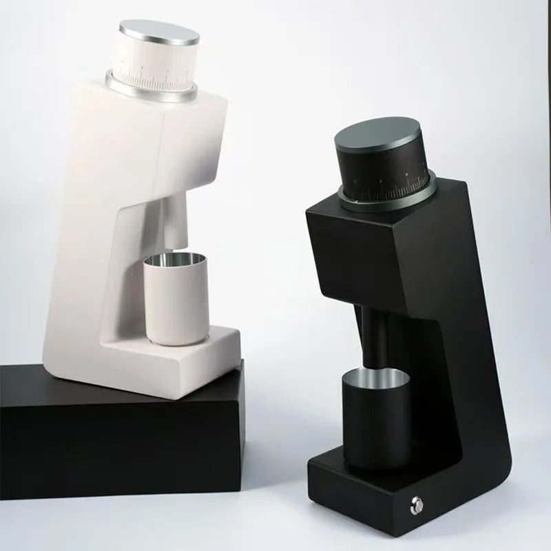 Electric coffee grinder with inclined aluminium alloy body in white on a countertop for home or office use