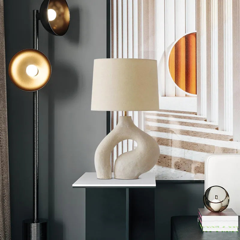 Modern minimalist table lamp with Nordic fabric shade on a bedside table