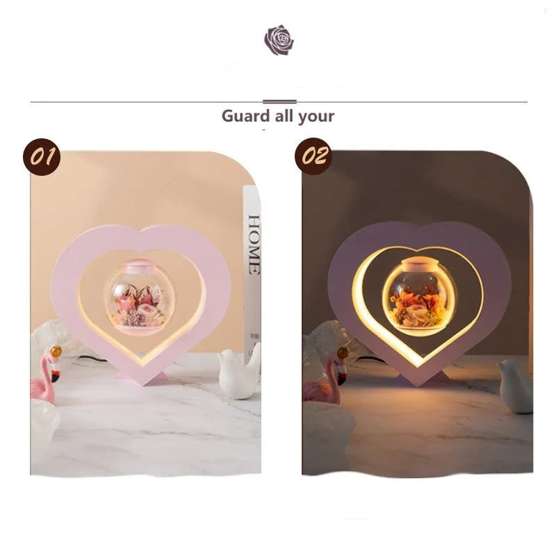 Pink preserved real rose ornament with optional base and Bluetooth audio speaker.
