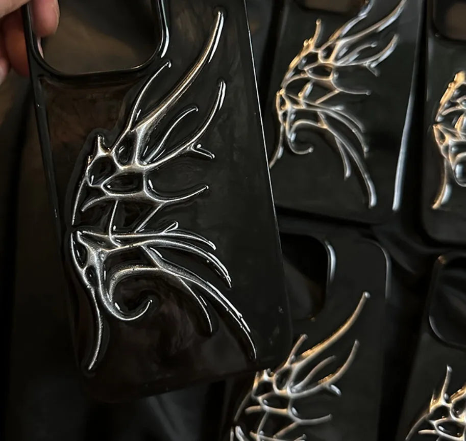 iPhone protective case featuring a raised three-dimensional wings design in a blurred wings colour.