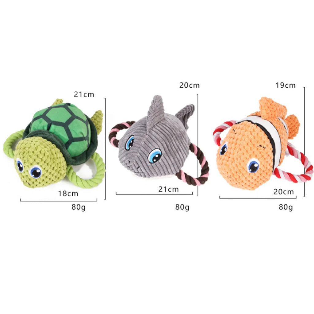 Grey turtle-shaped plush dog chew toy with knotted body and squeaker.