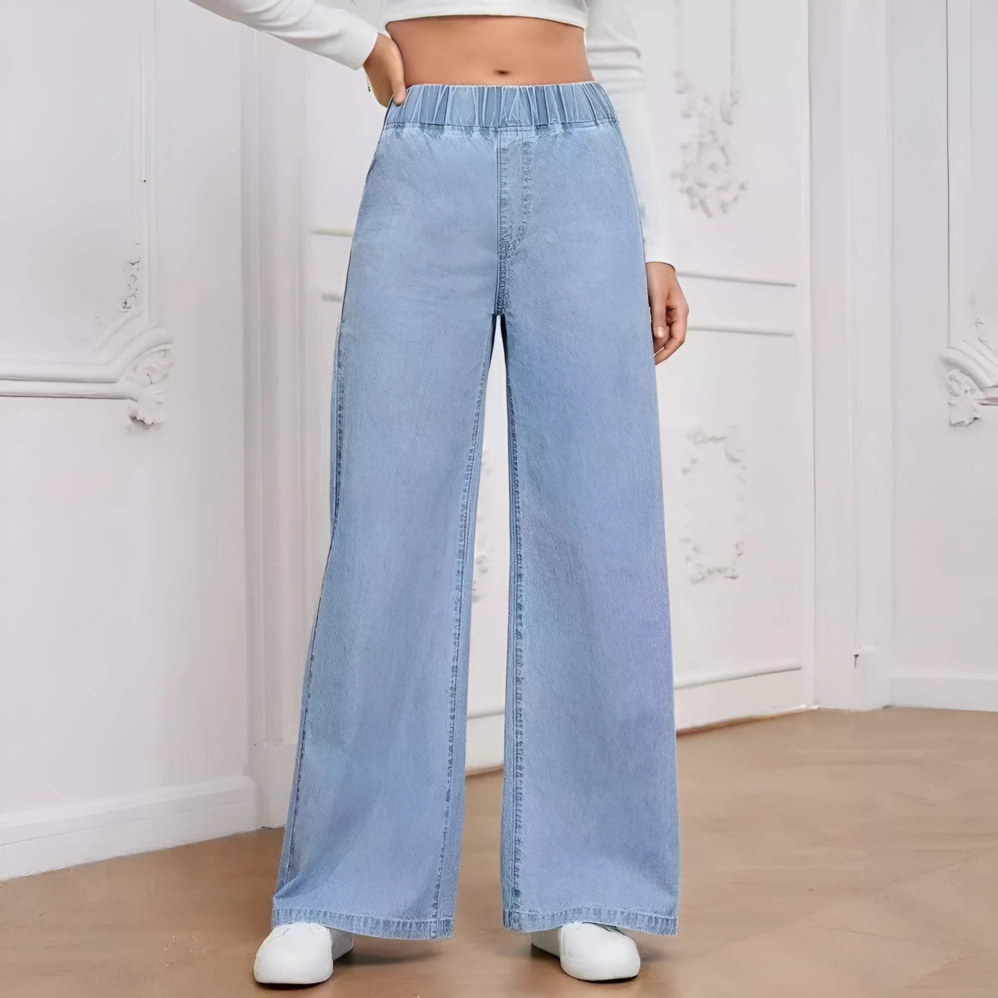 Light blue washed wide-leg women's denim jeans with straight fit and mid-rise waist