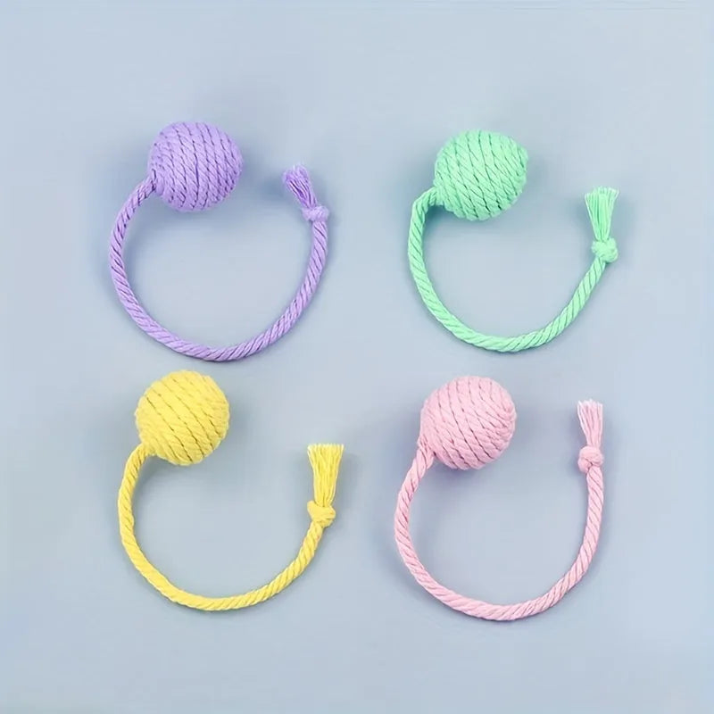 Colourful cat toy ball with attached rope, internal bell makes sound when rolled