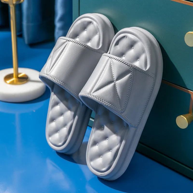 Pair of soft EVA bathroom slippers with a thick non-slip sole, shown in a selection of colours.