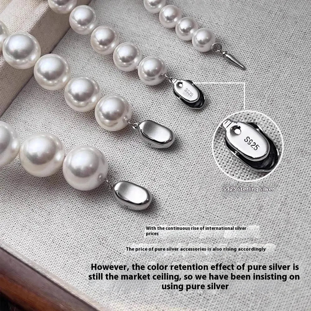 925 silver ingot buckle necklace with Australian white shell pearls on a model, unisex clavicle chain style