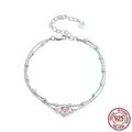 Women's sweet style sterling silver heart bracelet with adjustable chain on white background.