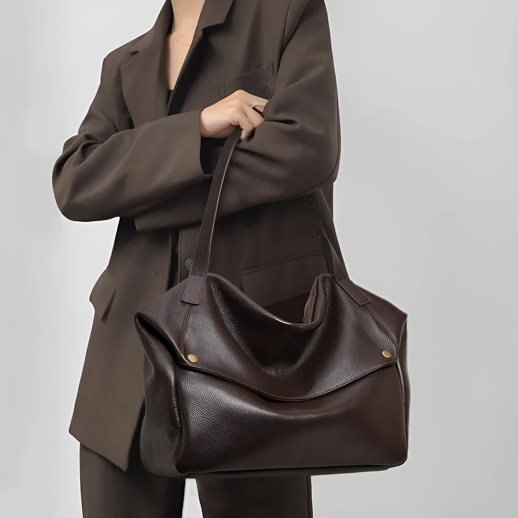 Brown genuine leather women's shoulder bag with a structured horizontal square shape.